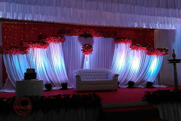 white & red theme floral stage decor 